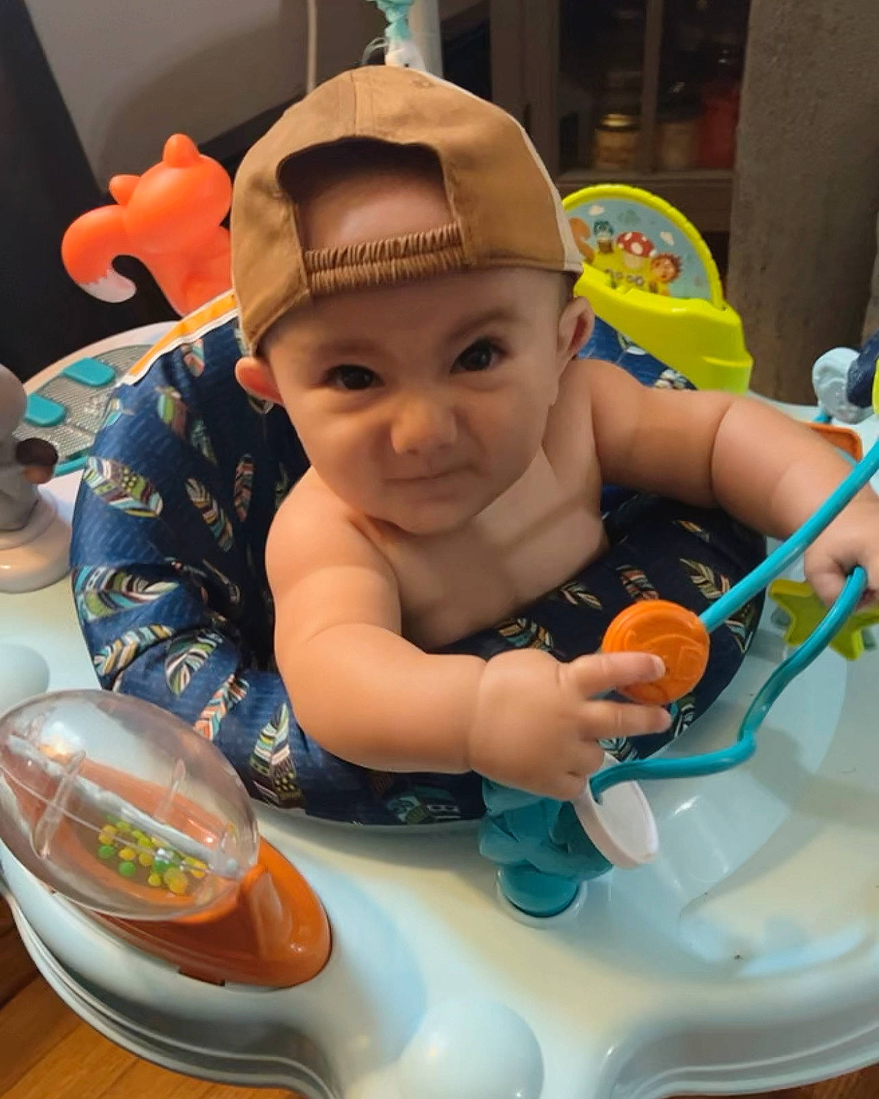 Lawson is registered to the contest to win money with this photo: baby, baby_products, baby_toddler_clothing, cheek, child, finger, fun, happy, headwear, leisure, mouth, person, personal_protective_equipment, recreation, sitting, skin, smile, snapshot, toddler, toy
