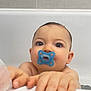 Ylann participe au concours pour gagner de l'argent avec cette photo : baby, bath_time, bathroom, bathtub, child, clinging, closeup, curious, ear, eyes, face, hand, infant, pacifier, portrait, skin, tile_wall, water_droplets, wet_skin, young_child