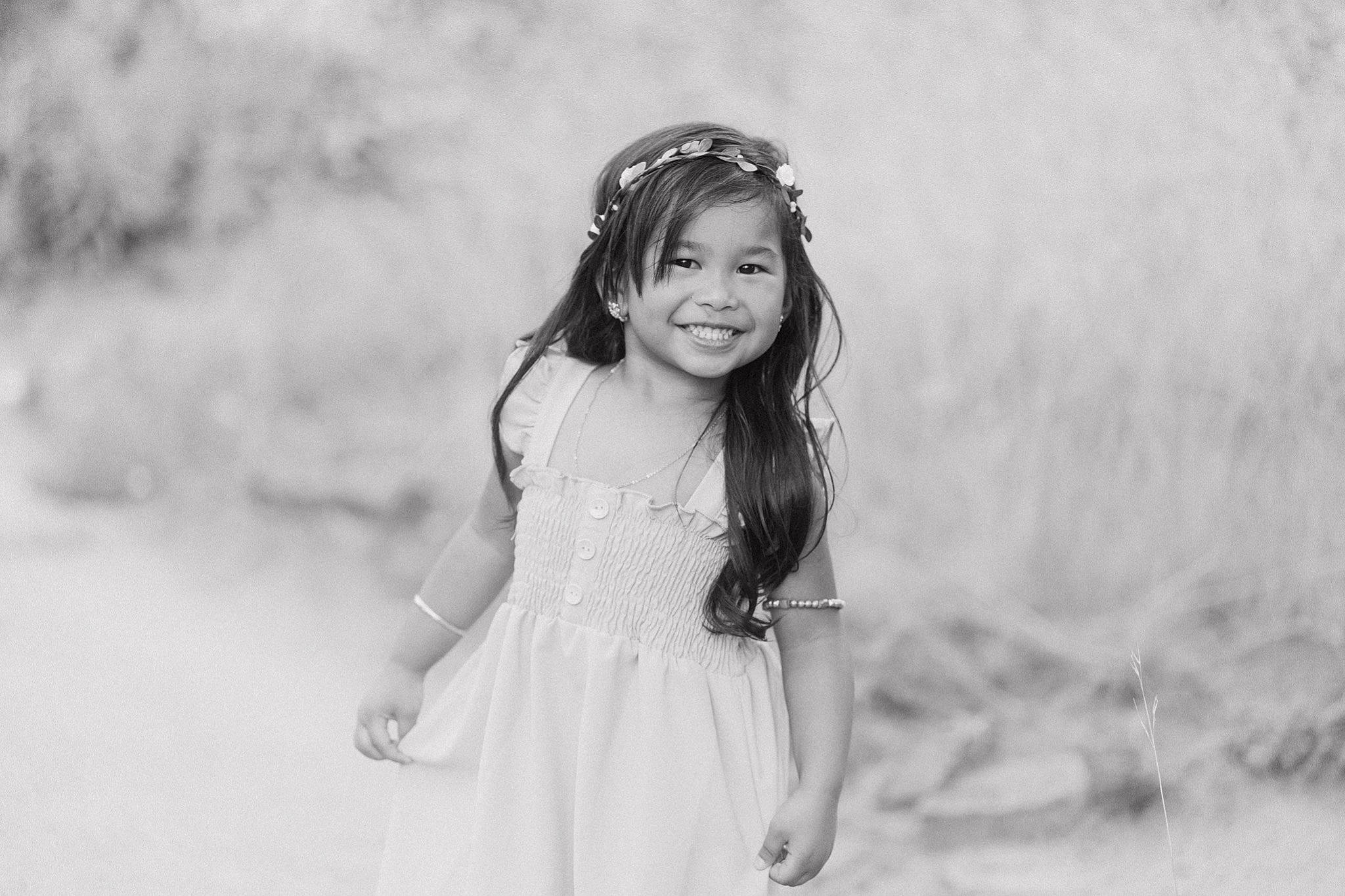 Jasmine is registered to the contest to win money with this photo: black_hair, blond, day_dress, dress, flash_photography, fun, grass, grassland, happy, headpiece, joy, landscape, long_hair, meadow, monochrome, monochrome_photography, people_in_nature, person, plant, smile