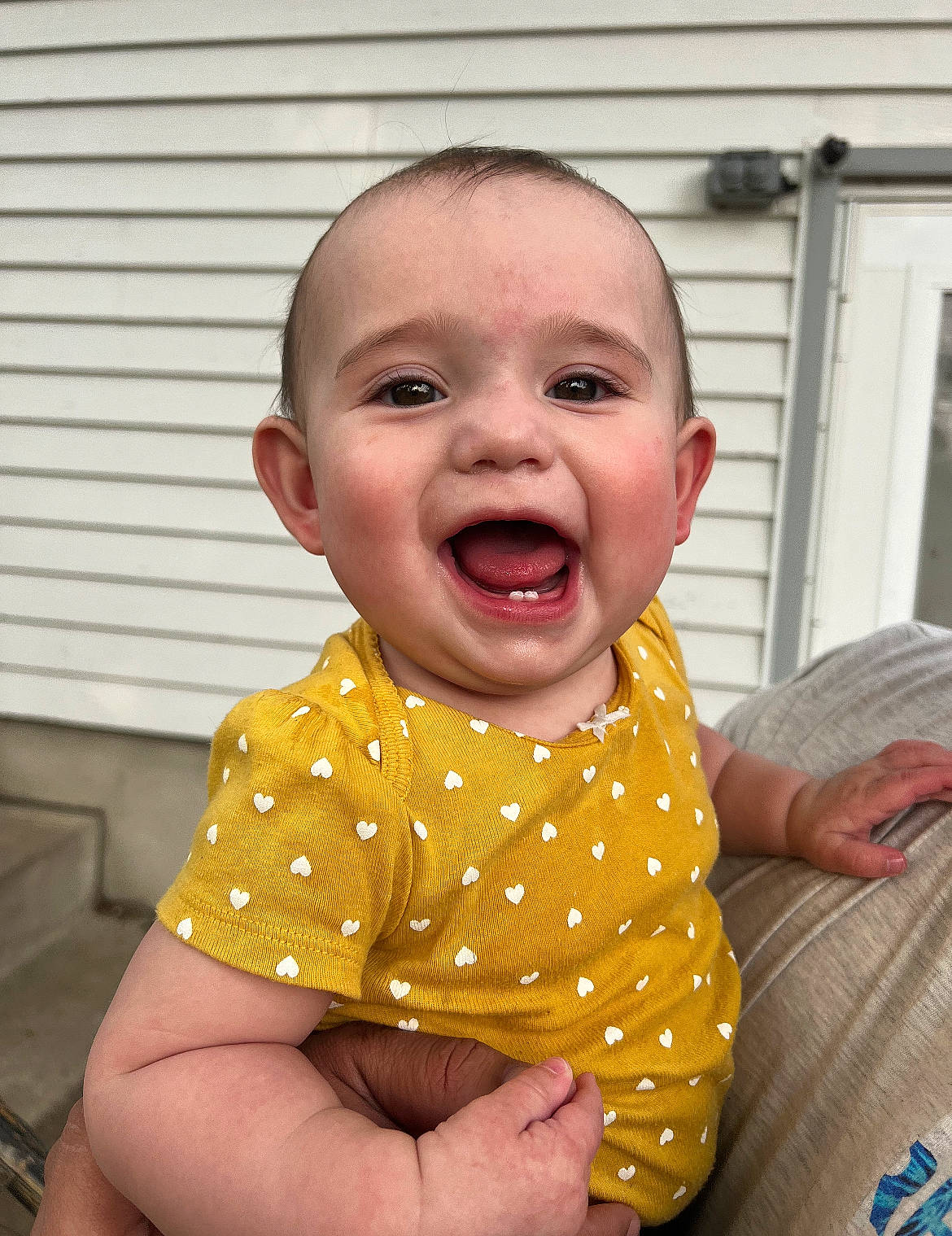 Rozalyn is registered to the contest to win money with this photo: baby, baby_laughing, baby_toddler_clothing, cheek, child, chin, comfort, finger, fun, gesture, happy, human_body, mouth, nose, person, skin, sleeve, smile, t_shirt, thumb