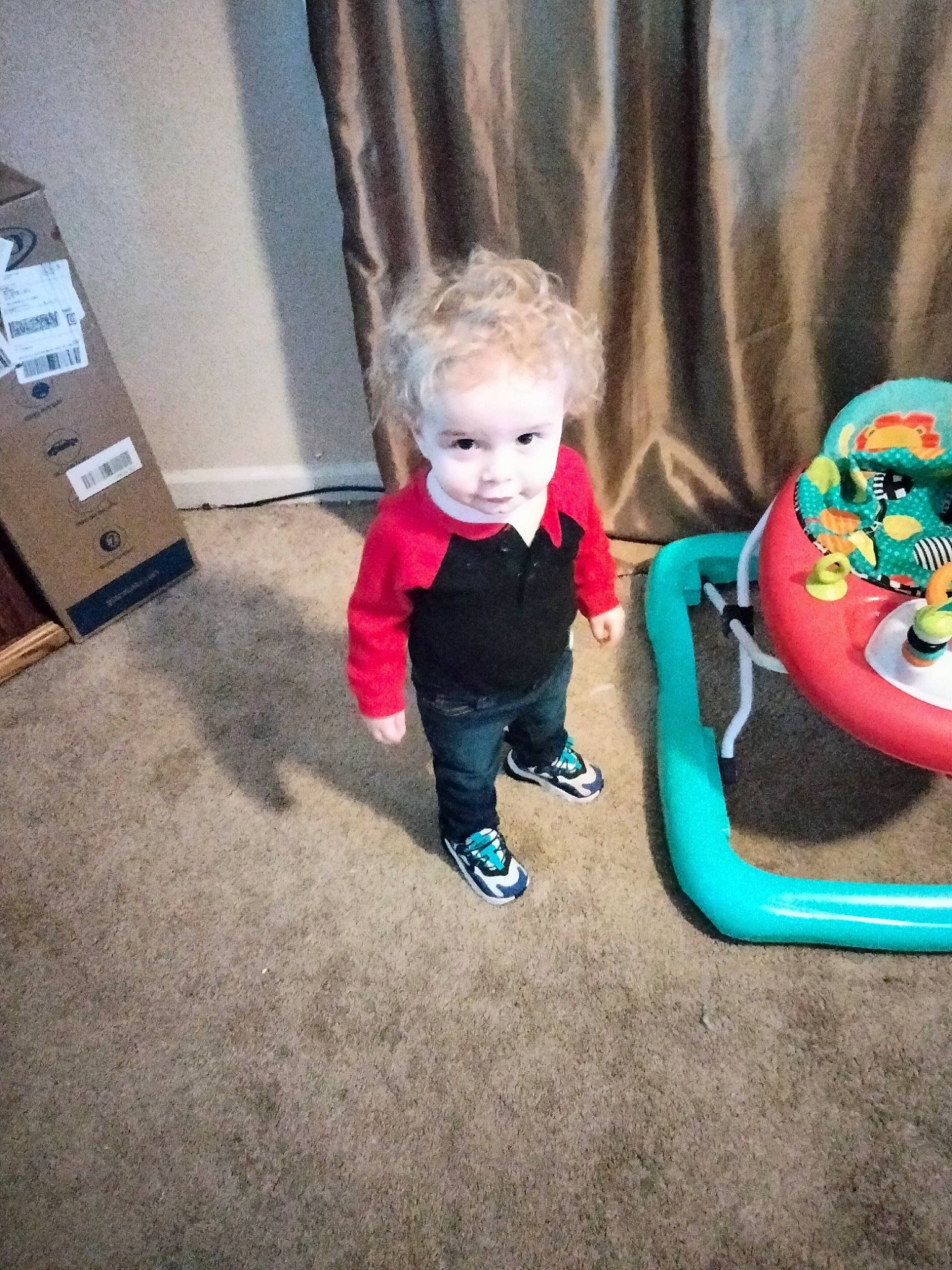 Chase is registered to the contest to win money with this photo: baby, baby_products, baby_toddler_clothing, baby_toys, box, child, electric_blue, floor, flooring, fun, happy, leisure, person, play, room, shipping_box, sitting, sleeve, toddler, toy