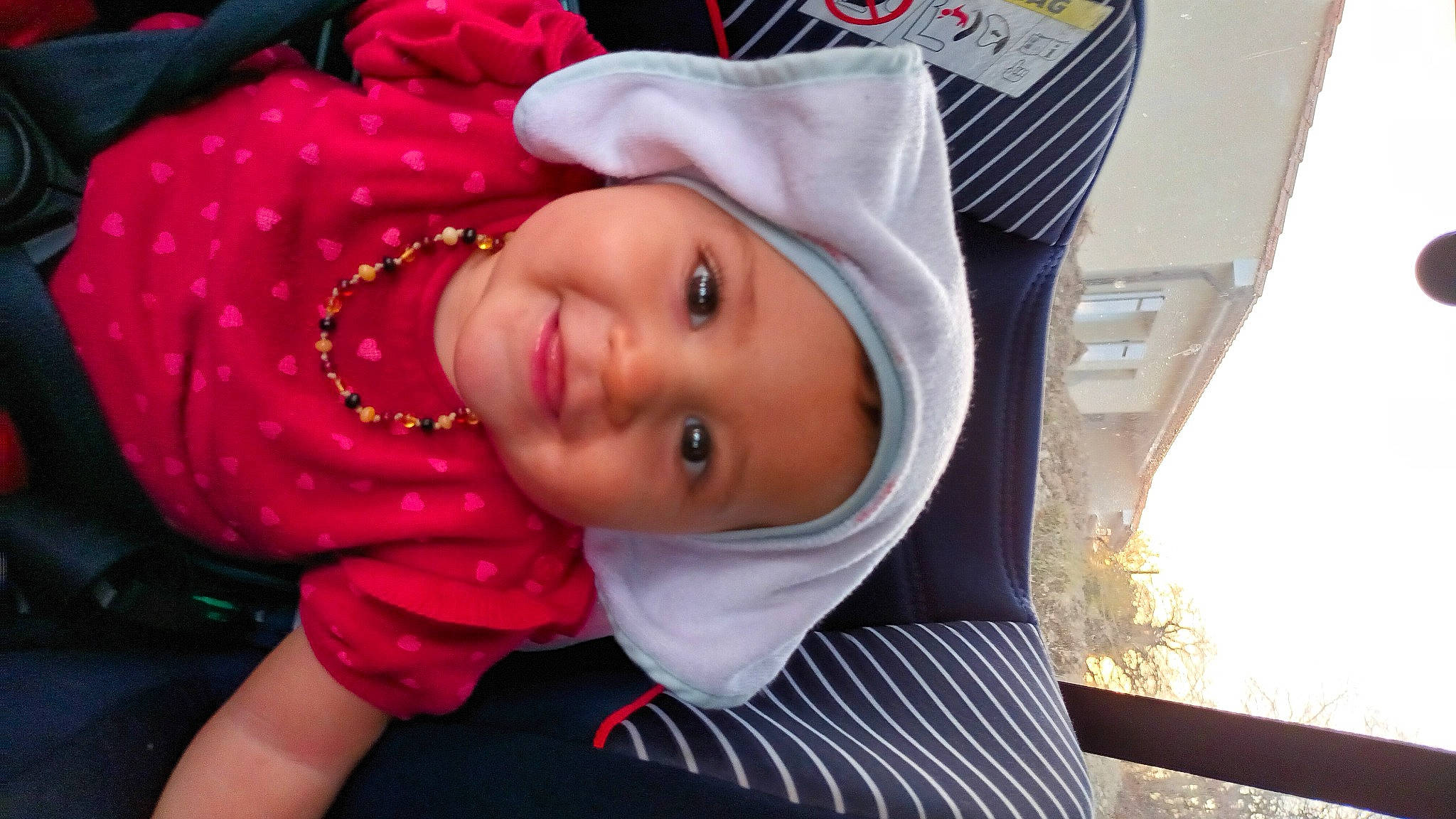 Mathilde participe au concours pour gagner de l'argent avec cette photo : baby, cheek, chin, eyebrow, eyelash, fun, happy, headgear, headwear, human_body, iris, jacket, joy, lip, mouth, nose, person, pink, skin, smile