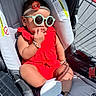 Aryahi is registered to the contest to win money with this photo: accessories, baby, baby_bracelet, baby_clothes, casual, child, comfort, cute, fashion, footwear, headband, infant, outdoor, portrait, red_dress, resting, shopping_cart, stroller, sunglasses, sunlight