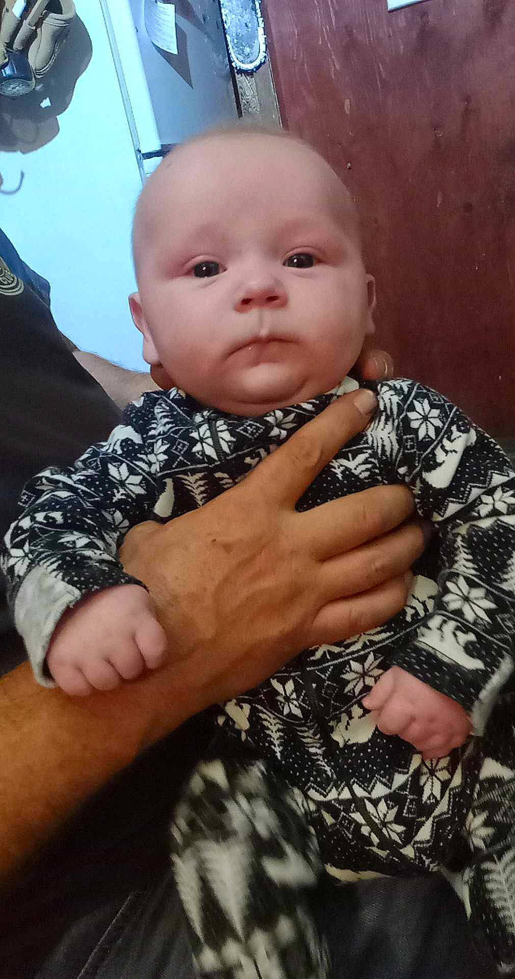 Heath is registered to the contest to win money with this photo: arm, baby, baby_toddler_clothing, cheek, chin, comfort, eye, finger, flash_photography, gesture, hand, happy, head, iris, lip, nose, person, skin, sleeve, thumb