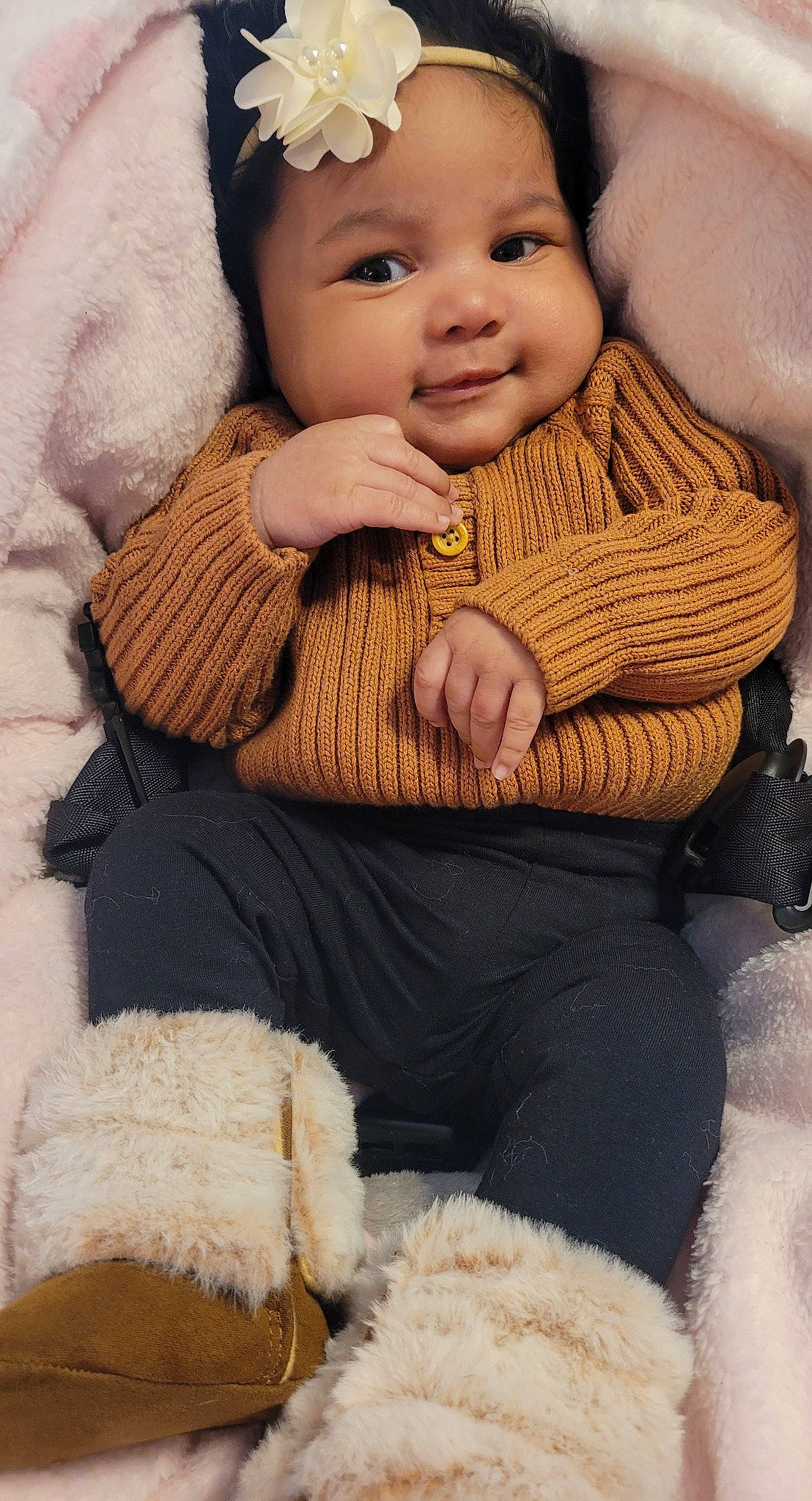 Damayiah is registered to the contest to win money with this photo: baby, baby_toddler_clothing, cheek, chin, comfort, eye, face, finger, gesture, hand, head, headwear, human_body, iris, lip, nose, organ, outerwear, person, skin