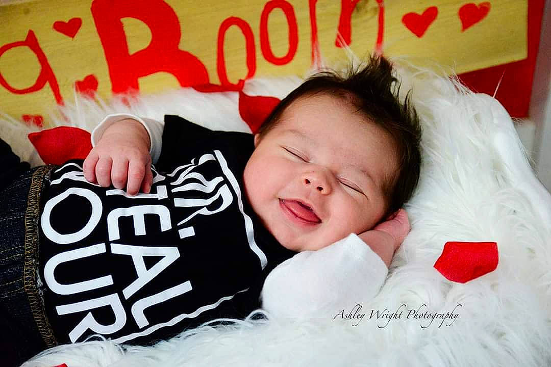 Maddux joined the competition — help win amazing prizes! baby, bedding, bedtime, child, happy, love, person, photo_caption, photography, pillow, red, textile, toddler