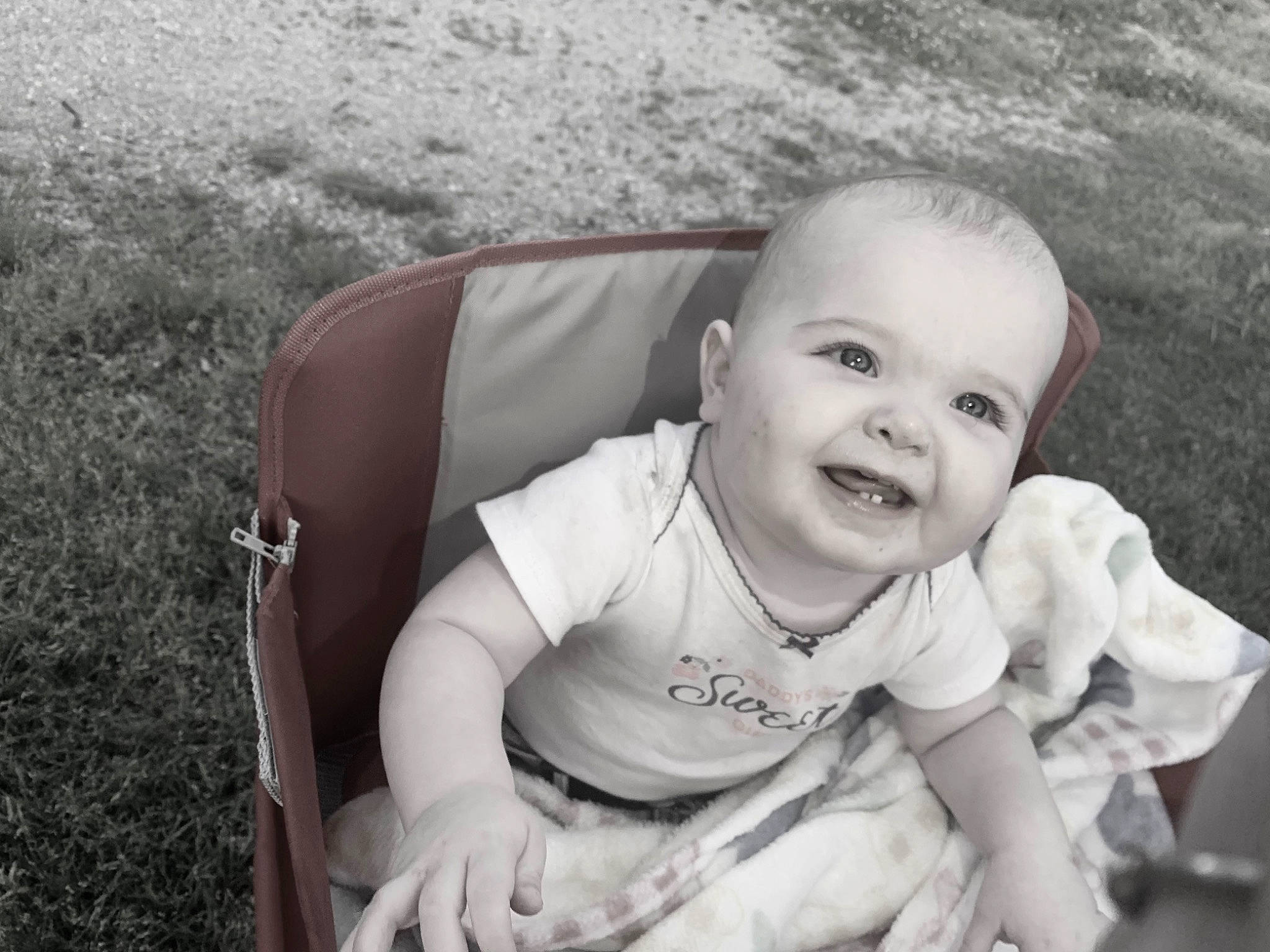 Chevelle is registered to the contest to win money with this photo: arm, baby, baby_toddler_clothing, black_and_white, child, comfort, dress, flash_photography, grass, hand, happy, iris, joy, monochrome, monochrome_photography, people_in_nature, person, sitting, skin, smile