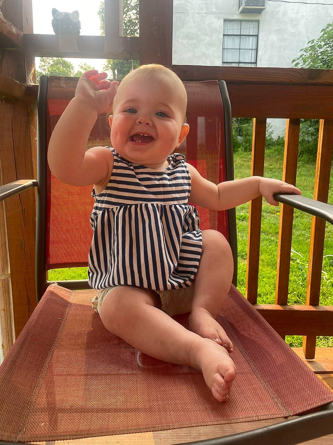 Chevelle is registered to the contest to win money with this photo: baby, baby_toddler_clothing, barefoot, comfort, finger, flooring, foot, happy, human_leg, joint, joy, leisure, outdoor_furniture, person, shoulder, sitting, skin, smile, thigh, thumb