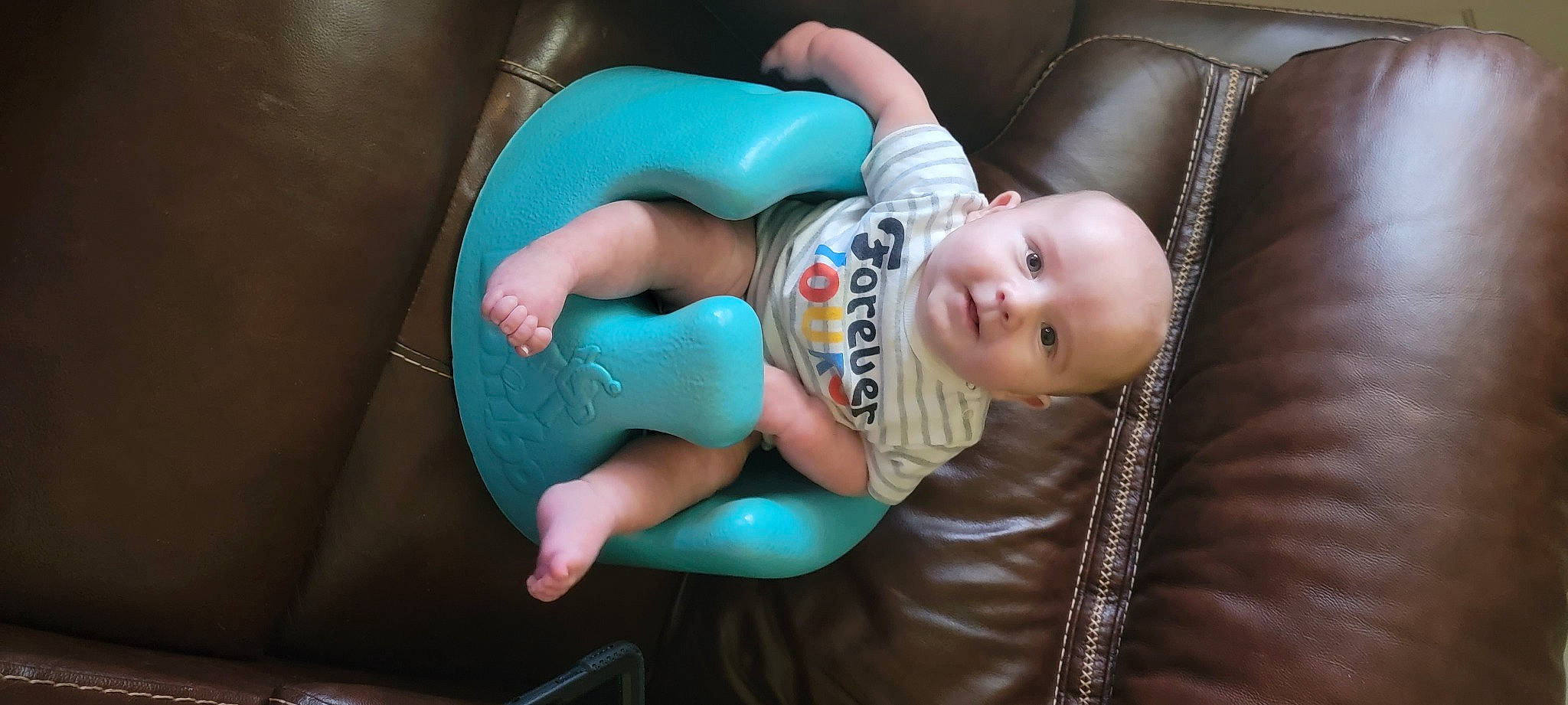 Jonah is registered to the contest to win money with this photo: abdomen, baby, baby_products, baby_toddler_clothing, chair, child, comfort, elbow, fun, health_care, human_leg, knee, mouth, nail, person, sitting, smile, thigh, thumb, toddler