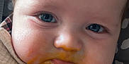 Louie joined the competition — help win amazing prizes! baby, blue_eyes, messy_face, baby_food, bib, close_up, face, infant, cute, food_stain, skin, child, young, expression, mouth, hair, eyebrows, cheeks, clothing, pattern