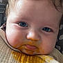 baby, blue_eyes, messy_face, baby_food, bib, close_up, face, infant, cute, food_stain, skin, child, young, expression, mouth, hair, eyebrows, cheeks, clothing, pattern