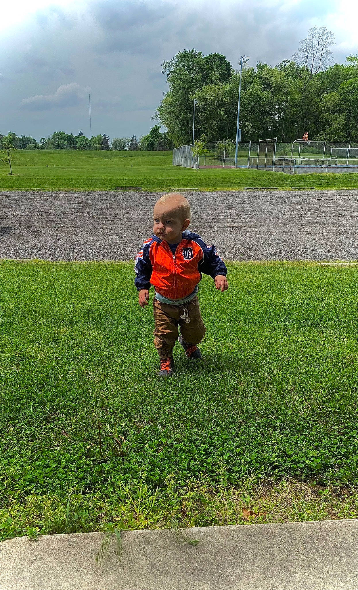 Xion is registered to the contest to win money with this photo: agriculture, cloud, field, fun, grass, grass_family, grassland, groundcover, landscape, lawn, meadow, people_in_nature, person, plain, plant, prairie, recreation, sky, soil, toddler