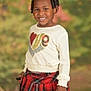 baby, babylaughing, blackhair, child, clothing, face, female, girl, hair, happy, head, kilt, person, photography, portrait, sitting, skirt, sleeve, smile, tartan