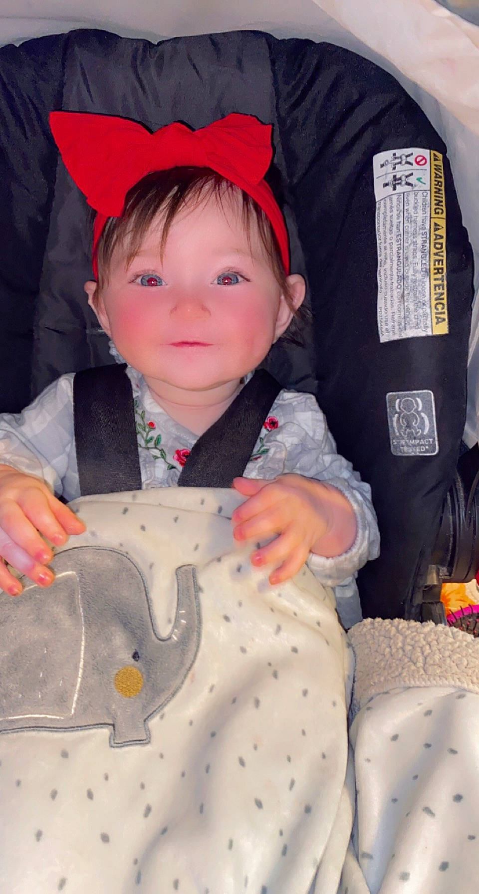 Harleigh is registered to the contest to win money with this photo: baby, baby_products, baby_toddler_clothing, button, cheek, child, costume, fashion_accessory, fun, happy, jacket, orange, outerwear, pattern, person, sitting, skin, sleeve, smile, textile