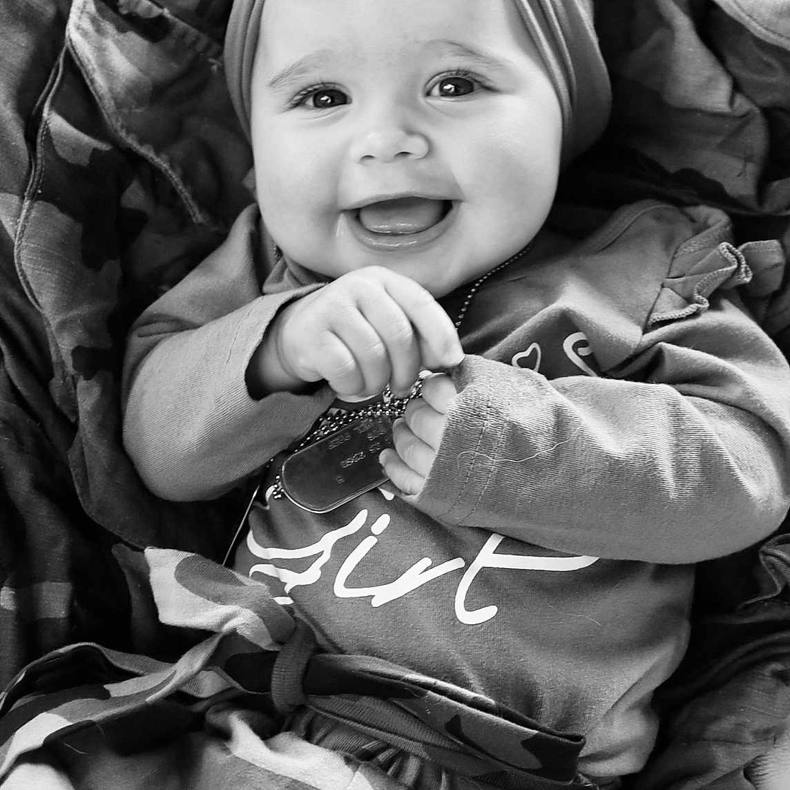 Blakely is registered to the contest to win money with this photo: baby, bodypart, cap, clothing, coat, face, finger, hand, happy, hat, head, hood, hoodie, jacket, knitwear, person, photography, portrait, smile, sweater