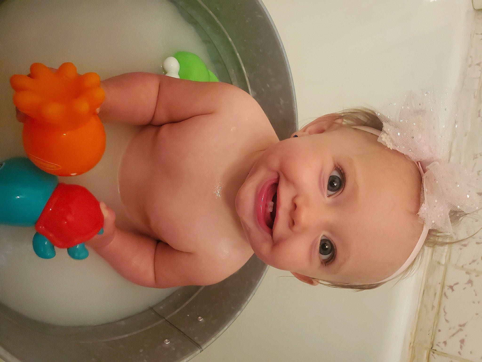 Lilyanna joined the competition — help win amazing prizes! baby, baby_bathing, baby_playing_with_toys, baby_toddler_clothing, bathing, cheek, child, eyelash, fun, hand, head, iris, joy, lip, mouth, nose, organ, person, pink, skin