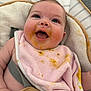 baby, bib, cheeks, child, closeup, clothing, cushion, cute, feeding, food_stains, happy, indoor, infant, messy_face, mouth_open, person, pink_bib, seat, skin, smiling