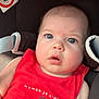 Mya a rejoint le concours — aidez-le/la à gagner de superbes lots ! airbag_warning, alert, attention, baby, blue_eyes, car_seat, casual, child, closeup, cute, expression, face, indoors, infant, person, portrait, red_clothing, safety_harness, seatbelt, young_child