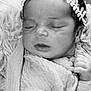 Giulia a rejoint le concours — aidez-le/la à gagner de superbes lots ! newborn, baby, sleeping, black_and_white, headband, blanket, closeup, portrait, infant, peaceful, soft_texture, wrapped, cute, tiny_hands, calm, indoors, cozy, face, person, resting