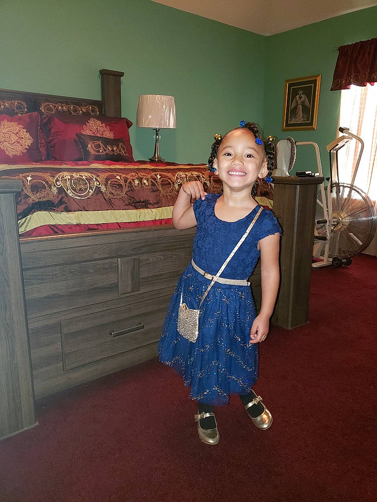 A'Myah joined the competition — help win amazing prizes! blue, child, clothing, costume, day, dress, flooring, fun, girl, happiness, joy, pattern, person, room, shoulder, smile, snapshot, standing, textile, toddler