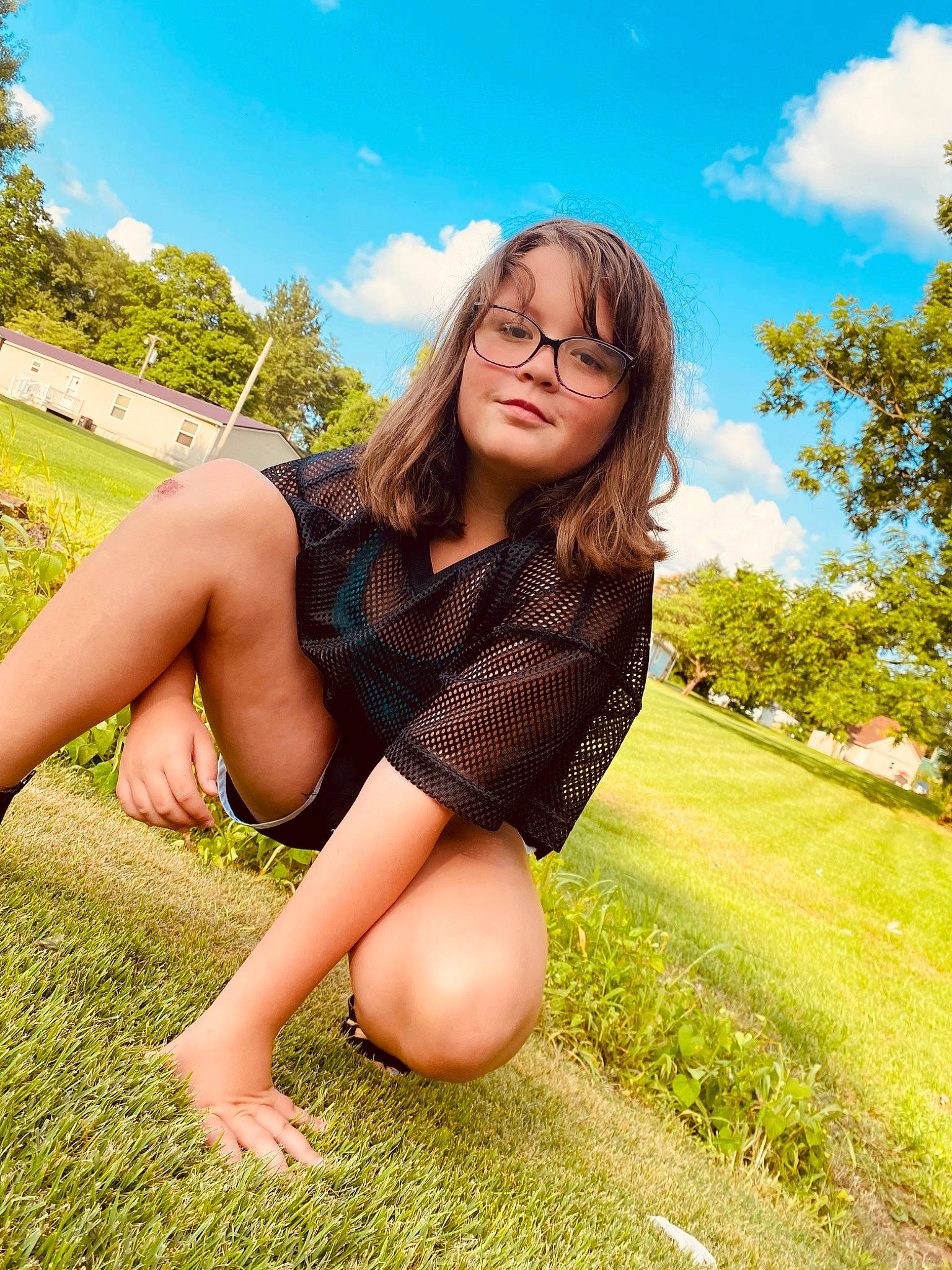 Lillian is registered to the contest to win money with this photo: black_hair, cloud, flash_photography, grass, grassland, happy, knee, leg, leisure, long_hair, meadow, nature, people_in_nature, person, plant, shoulder, sky, sunlight, thigh, tree