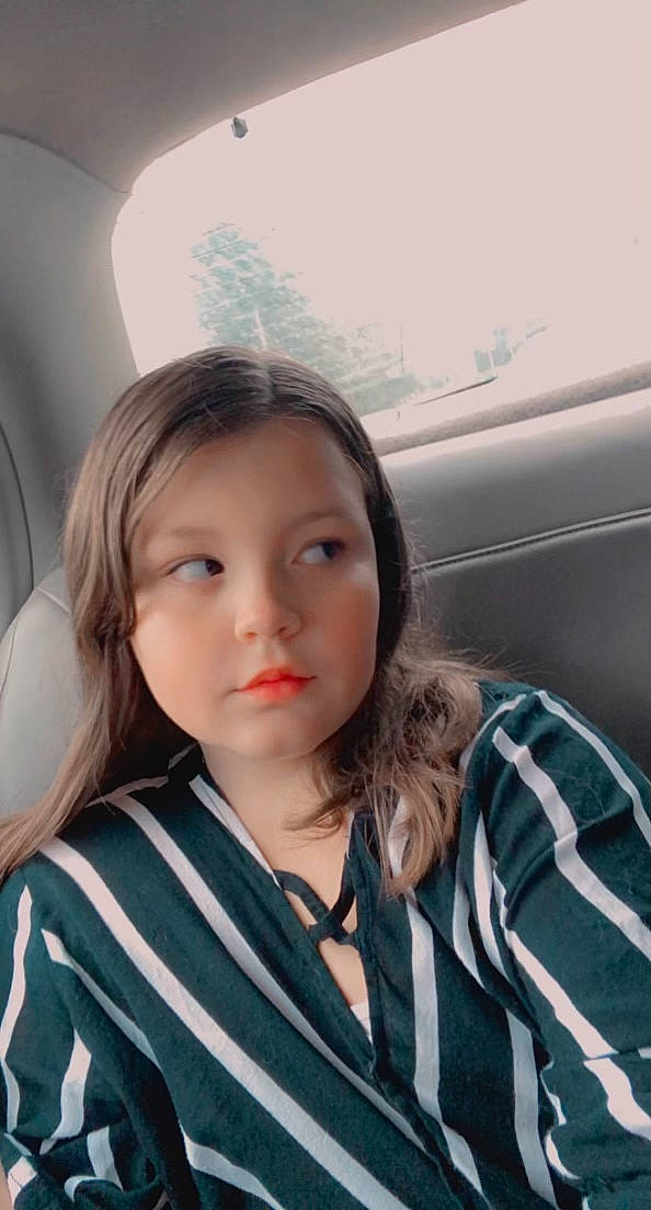 Lillian joined the competition — help win amazing prizes! auto_part, automotive_design, automotive_exterior, brown_hair, car, car_seat, child, family_car, lip, long_hair, luxury_vehicle, motor_vehicle, nose, person, personal_luxury_car, plaid, selfie, skin, street_fashion, travel
