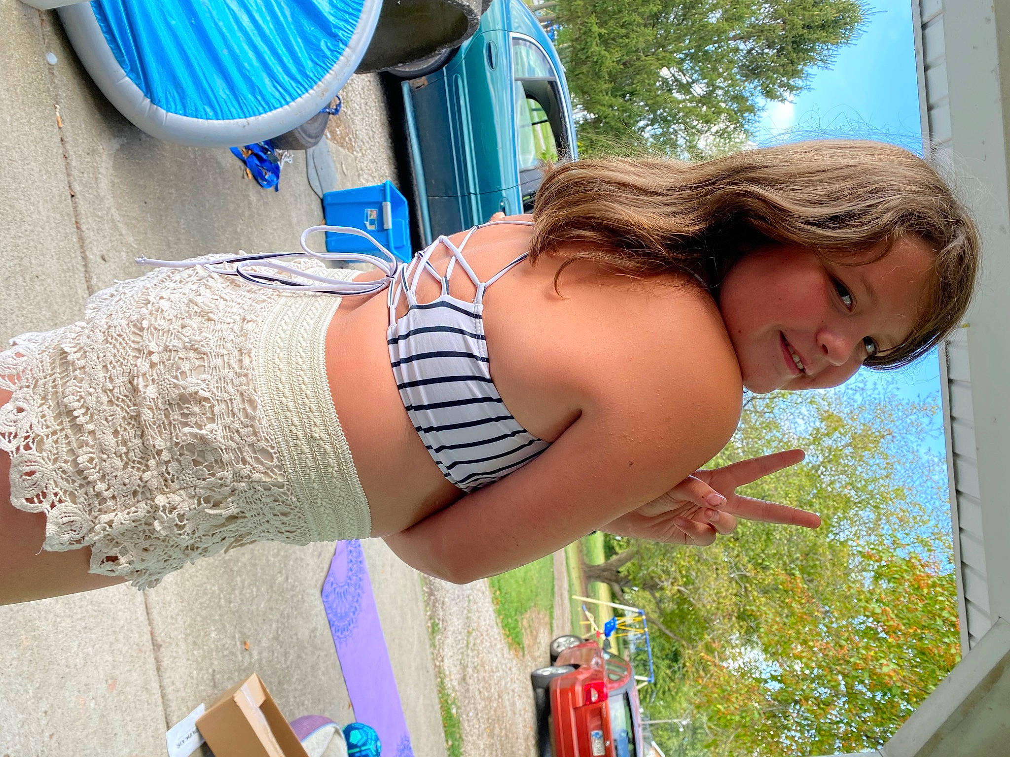 Lillian is registered to the contest to win money with this photo: blue, dress, fun, grass, green, hairstyle, happy, human_body, joint, joy, leisure, light, people, person, photograph, plant, sky, summer, thigh, tree