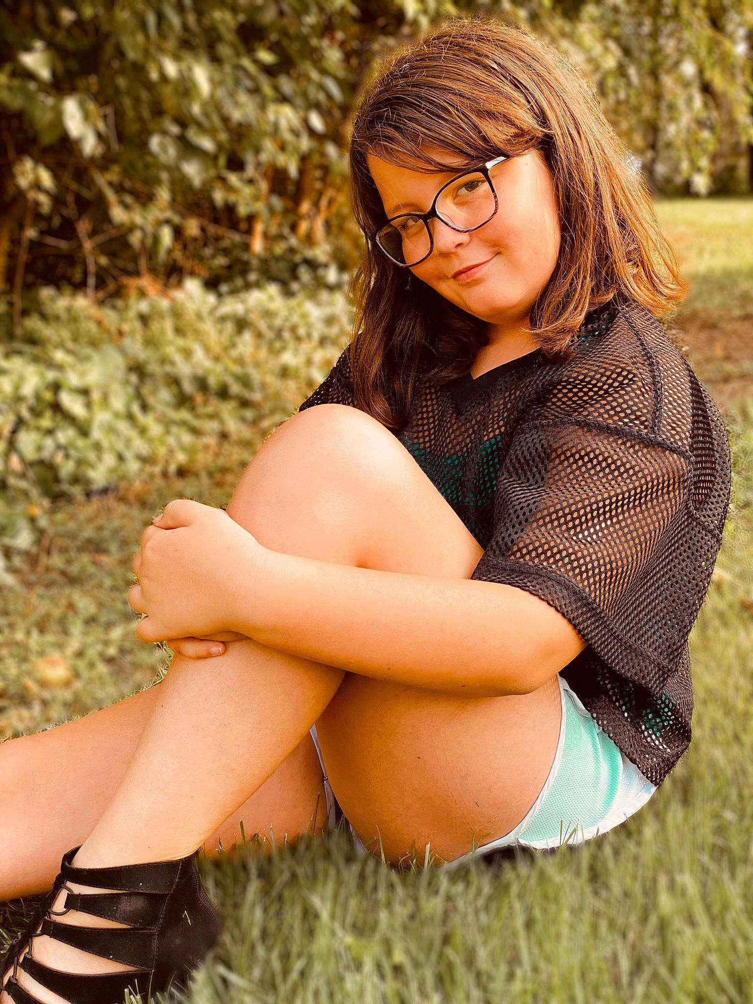 Lillian joined the competition — help win amazing prizes! face, facial_expression, flash_photography, glasses, grass, hair, happy, human_body, joint, joy, leg, light, lip, nature, people_in_nature, person, photograph, shoe, shorts, shoulder