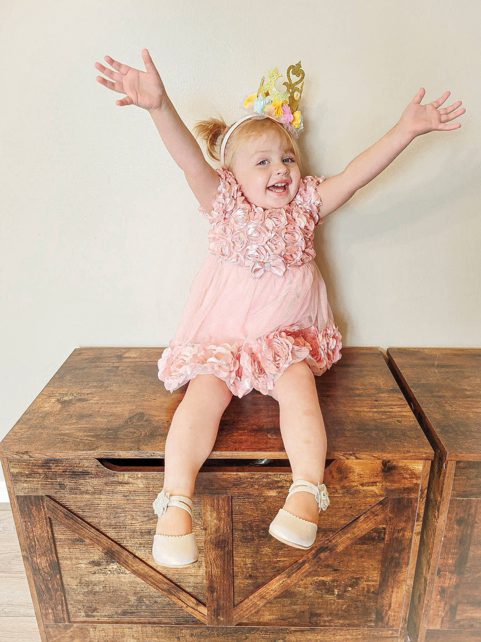 Avery Kailani joined the competition — help win amazing prizes! baby_toddler_clothing, child, day_dress, dress, fashion_accessory, fashion_design, flash_photography, happy, headpiece, human_leg, joy, knee, pattern, peach, person, pink, room, sitting, smile, thigh