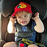 toddler, child, car_seat, red_hat, bass_pro_shops, smiling, seatbelt, sunlight, blue_shirt, safety_harness, baby, cute, happy, infant, portrait, inside_car, seat, hands, face, young_child