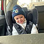 Mayron a rejoint le concours — aidez-le/la à gagner de superbes lots ! child, toddler, car_seat, beanie, hat, smile, car_interior, seat_belt, child_seat, fleece_jacket, cozy, portrait, candid, backseat, window, urban_background, happy, cheeky_smile, young_child, safety_harness
