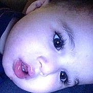Quentin is registered to the contest to win money with this photo: child, toddler, face, closeup, eye, hand, expression, skin, mouth, eyelash, indoor, person, portrait, head, resting, young, baby, sleepy, waiting, text_overlay