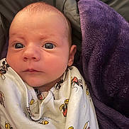 Kaylah is registered to the contest to win money with this photo: baby, blanket, bonnet, clothing, cushion, face, furniture, happy, hat, head, homedecor, hoodie, knitwear, newborn, person, photography, portrait, quilt, smile, towel