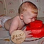 Zander is registered to the contest to win money with this photo: baby, infant, diaper, watermelon, fruit, cake, food, bite, six_months, sign, hand, face, cheek, crawling, patterned_mat, colorful, cute, plump, background, celebration