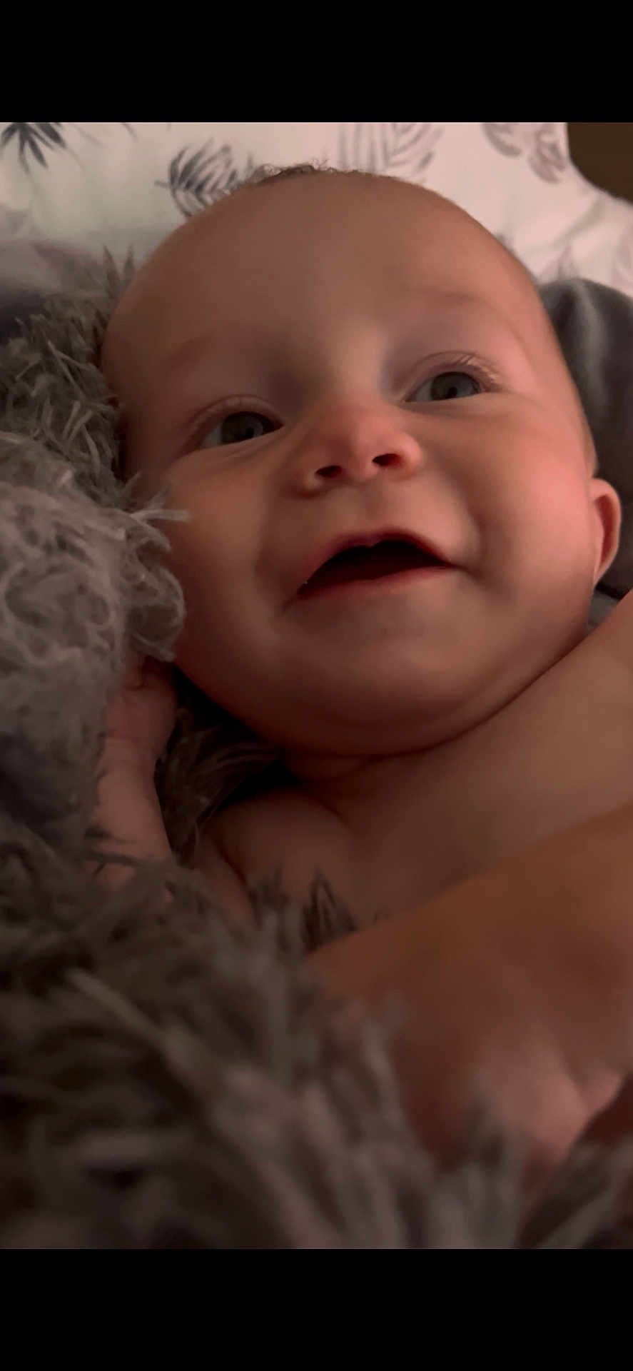 Weldyn is registered to the contest to win money with this photo: baby, infant, close_up, face, smile, blanket, soft_texture, skin, child, happy, cute, young, portrait, expression, indoors, cozy, newborn, childhood, warm, comfort