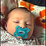 Oakleigh is registered to the contest to win money with this photo: baby, pacifier, blanket, floral_pattern, sleepy, infant, closeup, cute, child, portrait, soft_texture, cozy, heart_overlay, indoors, resting, newborn, face, comfort, warm, toddler