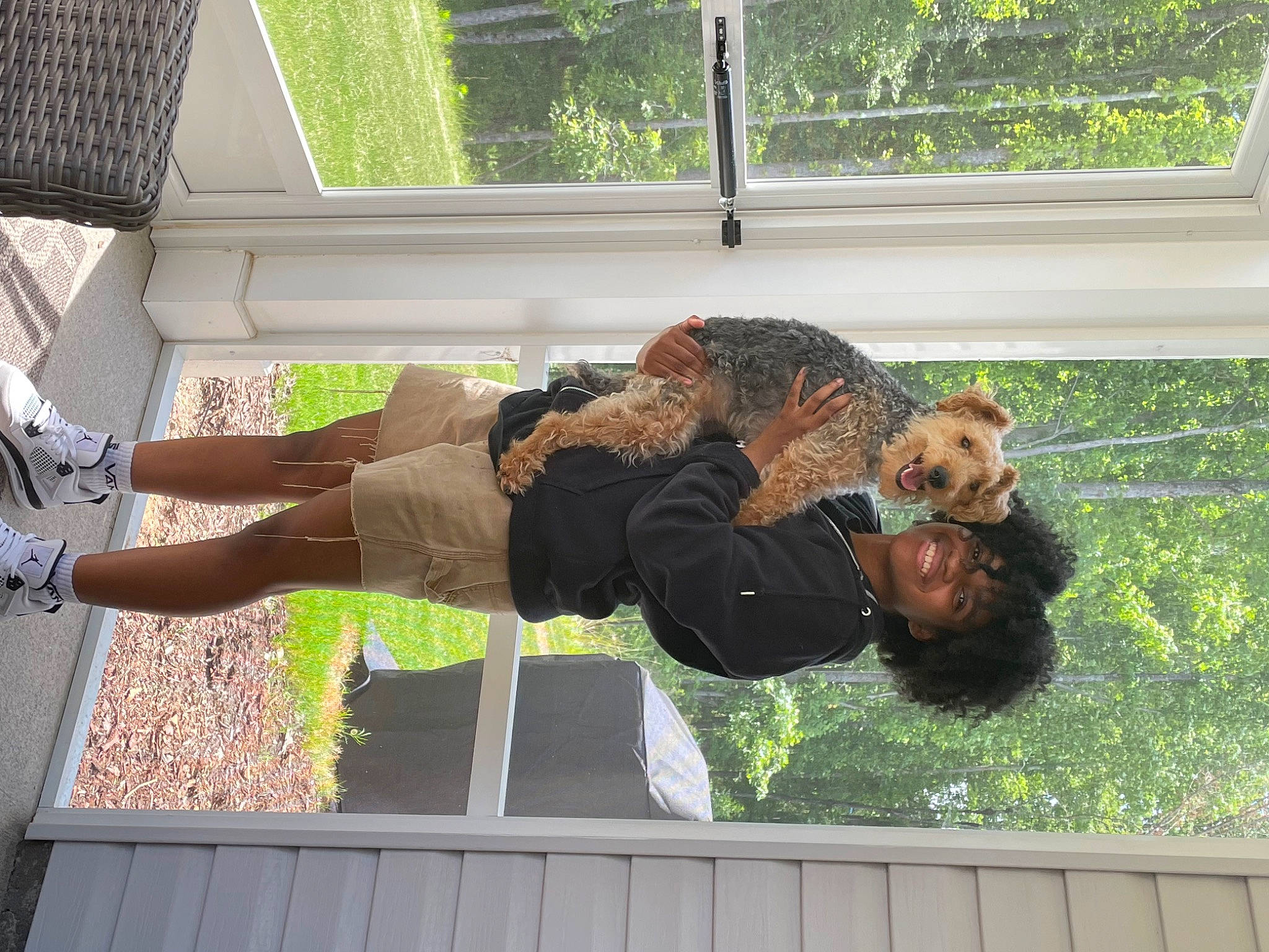 Leilani joined the competition — help win amazing prizes! companion_dog, dog_breed, fun, fur, grass, human_leg, leisure, plant, sporting_group, thigh, tree, window