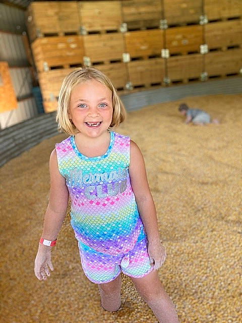 Kendall is registered to the contest to win money with this photo: barefoot, blond, child, dress, electric_blue, event, eye, fun, grass, happy, human_leg, iris, joy, leisure, long_hair, person, recreation, skin, smile, thigh