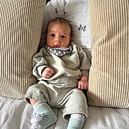 Mason joined the competition — help win amazing prizes! baby, infant, pillow, bed, blanket, clothing, socks, person, face, cute, indoor, sleepwear, soft, comfort, resting, child, young, cozy, expression, portrait