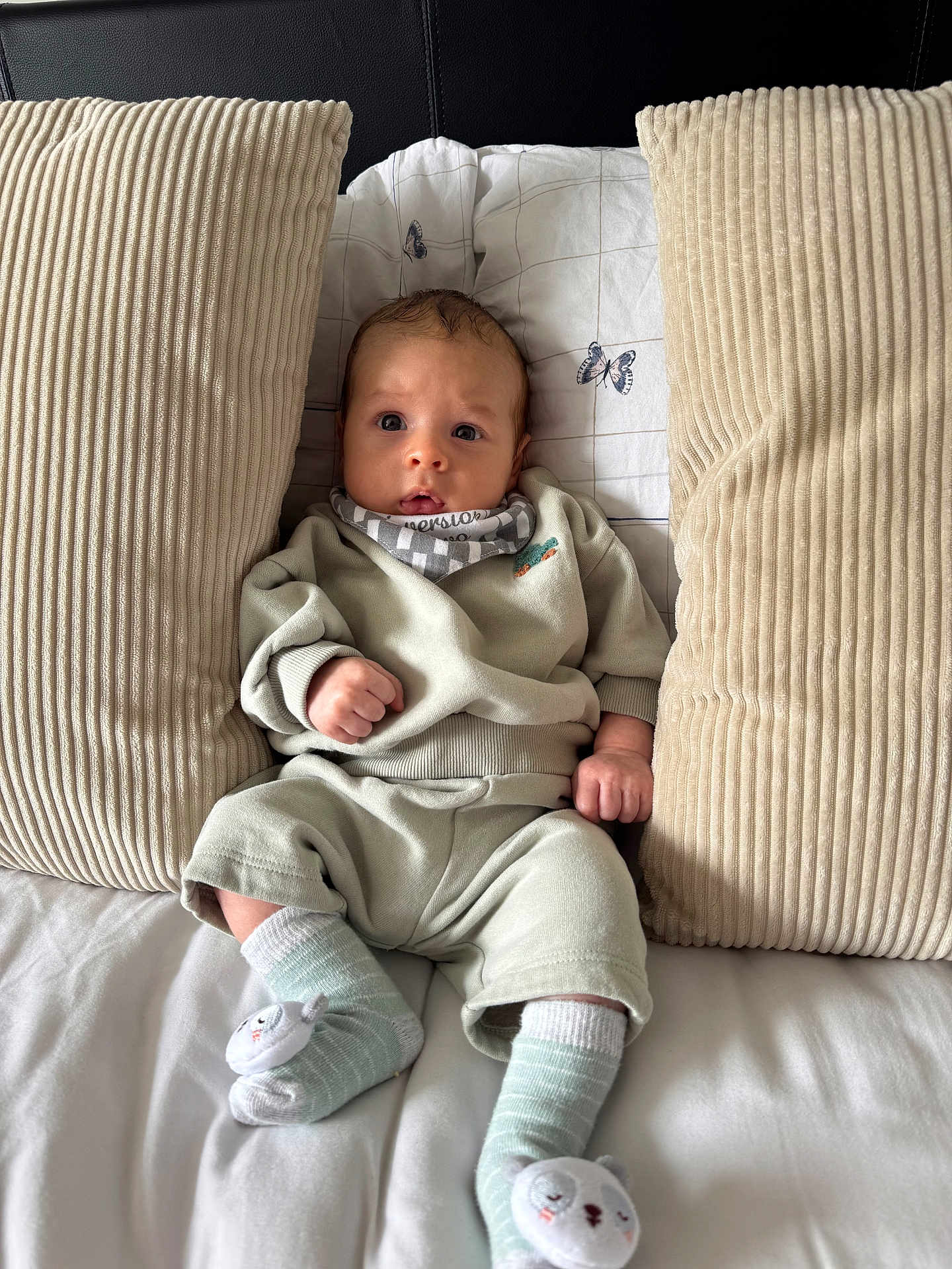 Mason joined the competition — help win amazing prizes! baby, infant, pillow, bed, blanket, clothing, socks, person, face, cute, indoor, sleepwear, soft, comfort, resting, child, young, cozy, expression, portrait