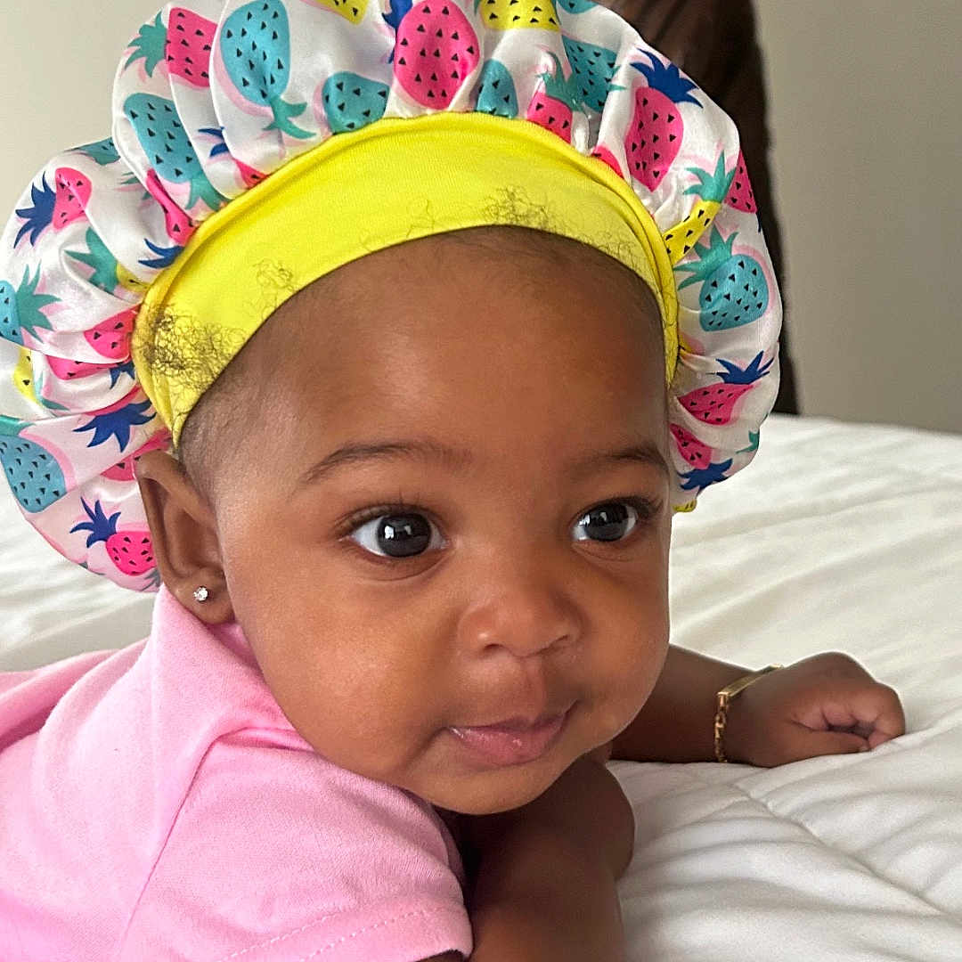 Kaylee is registered to the contest to win money with this photo: accessories, architecture, baby, bed, bonnet, building, cap, clothing, cushion, face, furniture, hat, head, homedecor, newborn, person, photography, portrait, sunhat, swimwear