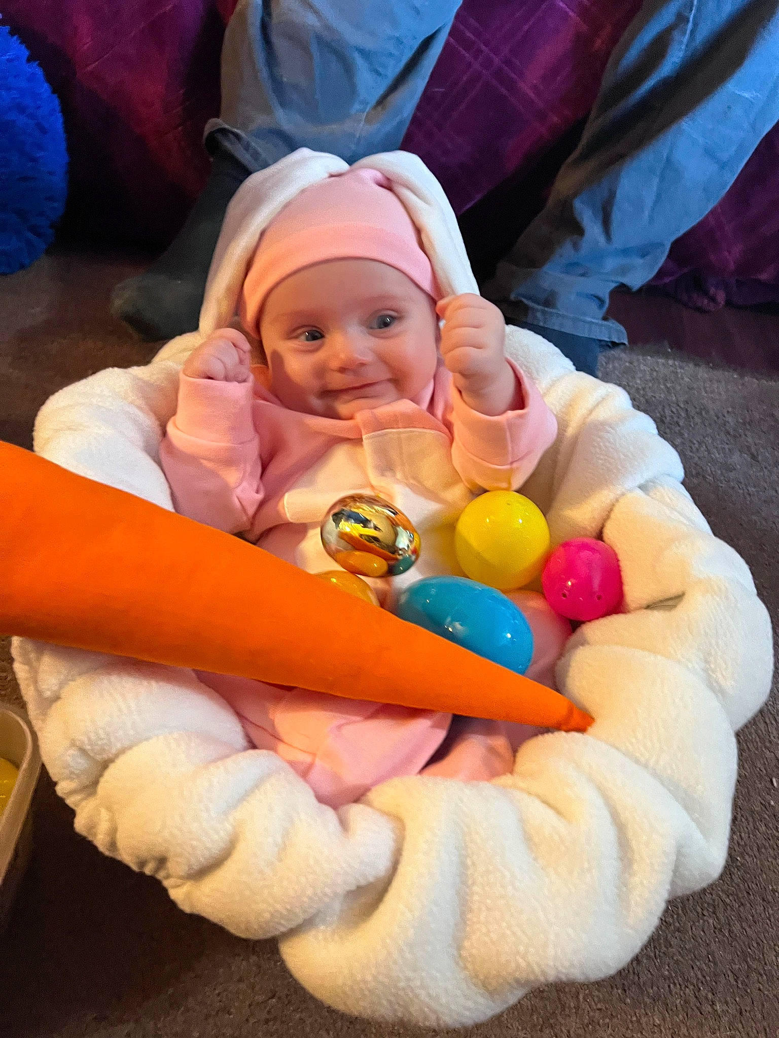 Elizabeth is registered to the contest to win money with this photo: baby, baby_playing_with_toys, baby_products, baby_toddler_clothing, child, comfort, event, fun, happy, headwear, joy, leisure, orange, person, play, recreation, sitting, skin, smile, stuffed_toy