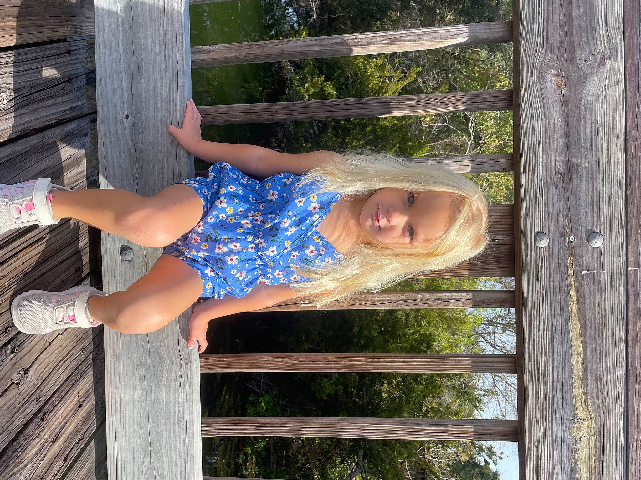 Evie joined the competition — help win amazing prizes! calf, child, elbow, electric_blue, fence, foot, fun, grass, happy, human_leg, knee, leisure, pattern, person, sitting, smile, thigh, tree, vacation, waist