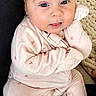 Lyla Jo joined the competition — help win amazing prizes! baby, child, onesie, heart_pattern, cute, infant, face, smile, tongue_out, sitting, cozy, blanket, cushion, indoor, person, young_child, pink, skin, head, expression