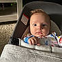 Noah joined the competition — help win amazing prizes! baby, infant, blanket, baby_seat, face, indoor, carpet, furniture, curious, clothing, cushion, child, person, soft_lighting, expression, hand, head, seat_belt, comfort, portrait