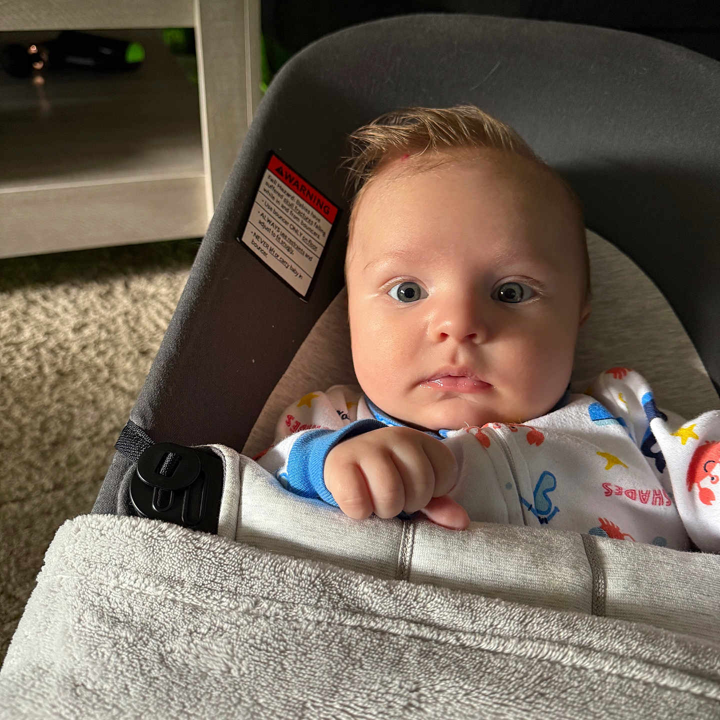 Noah joined the competition — help win amazing prizes! baby, baby_seat, blanket, carpet, child, clothing, comfort, curious, cushion, expression, face, furniture, hand, head, indoor, infant, person, portrait, seat_belt, soft_lighting
