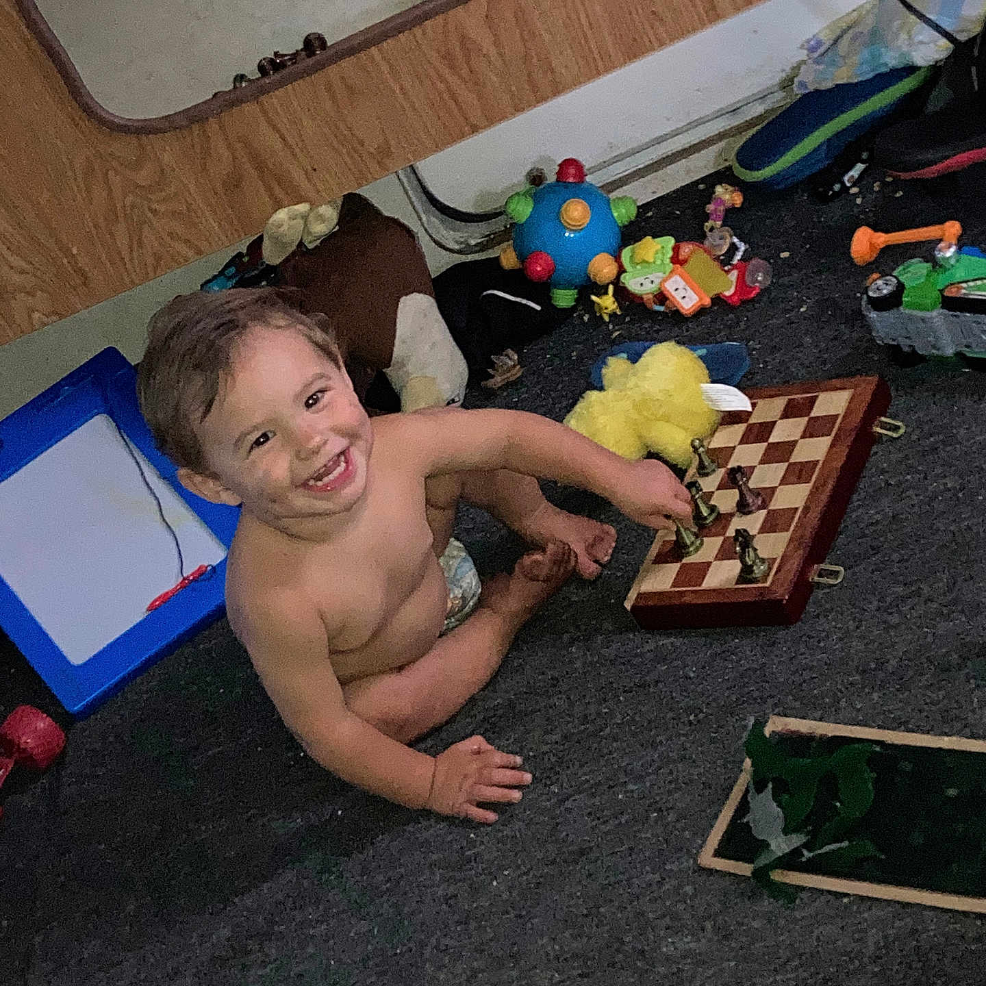 Chaytan is registered to the contest to win money with this photo: baby, babycrawling, bathing, boy, chess, child, crawling, diaper, face, game, head, legoset, male, person, photography, play, portrait, sitting, toy