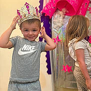 Jeremy joined the competition — help win amazing prizes! child, boy, girl, crown, nike, grey_clothing, leopard_print, indoor, smile, decorations, door, floor, happy, standing, person, young_child, casual_clothing, background, celebration, playful