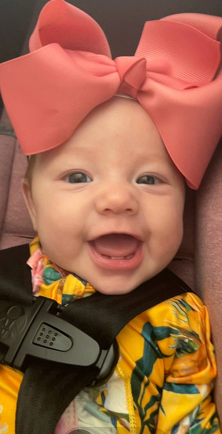 Huxley is registered to the contest to win money with this photo: cheek, chin, eye, face, facial_expression, happy, head, headwear, human, lip, mouth, nose, organ, outerwear, person, photograph, pink, product, skin, smile