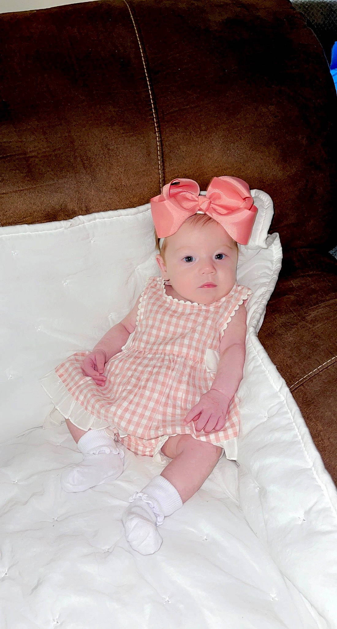 Huxley is registered to the contest to win money with this photo: baby, baby_toddler_clothing, child, comfort, dress, embellishment, eye, face, head, headgear, leg, magenta, one_piece_garment, outerwear, pattern, person, pink, skin, sleeve, textile